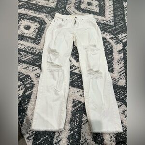 White jeans size 1/24 has rips on the legs for fashion